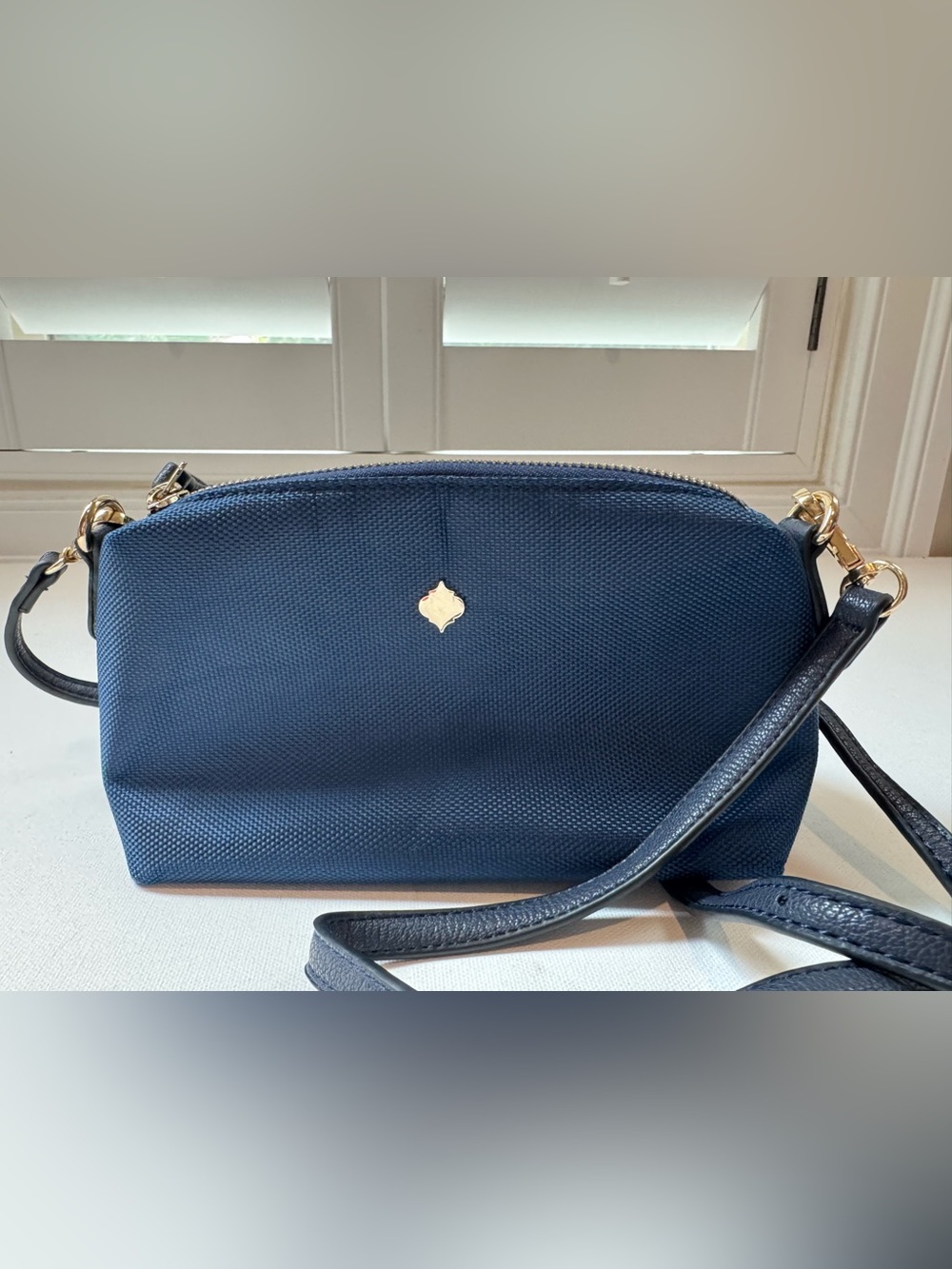 Fornash women’s navy crossbody bag with gold hardware perfect for travel